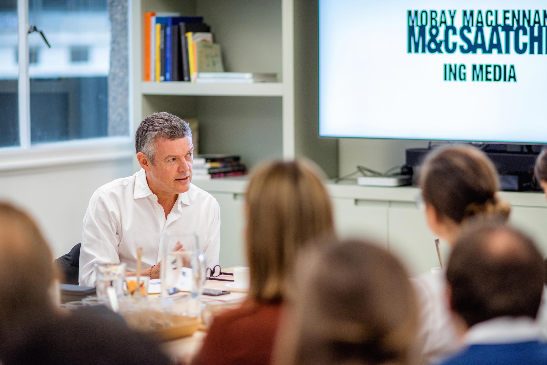 Moray MacLennan from M&C Saatchi Group gives a talk to an office full of professionals in this lifestyle office picture, shot in reportage style by Wright Content.