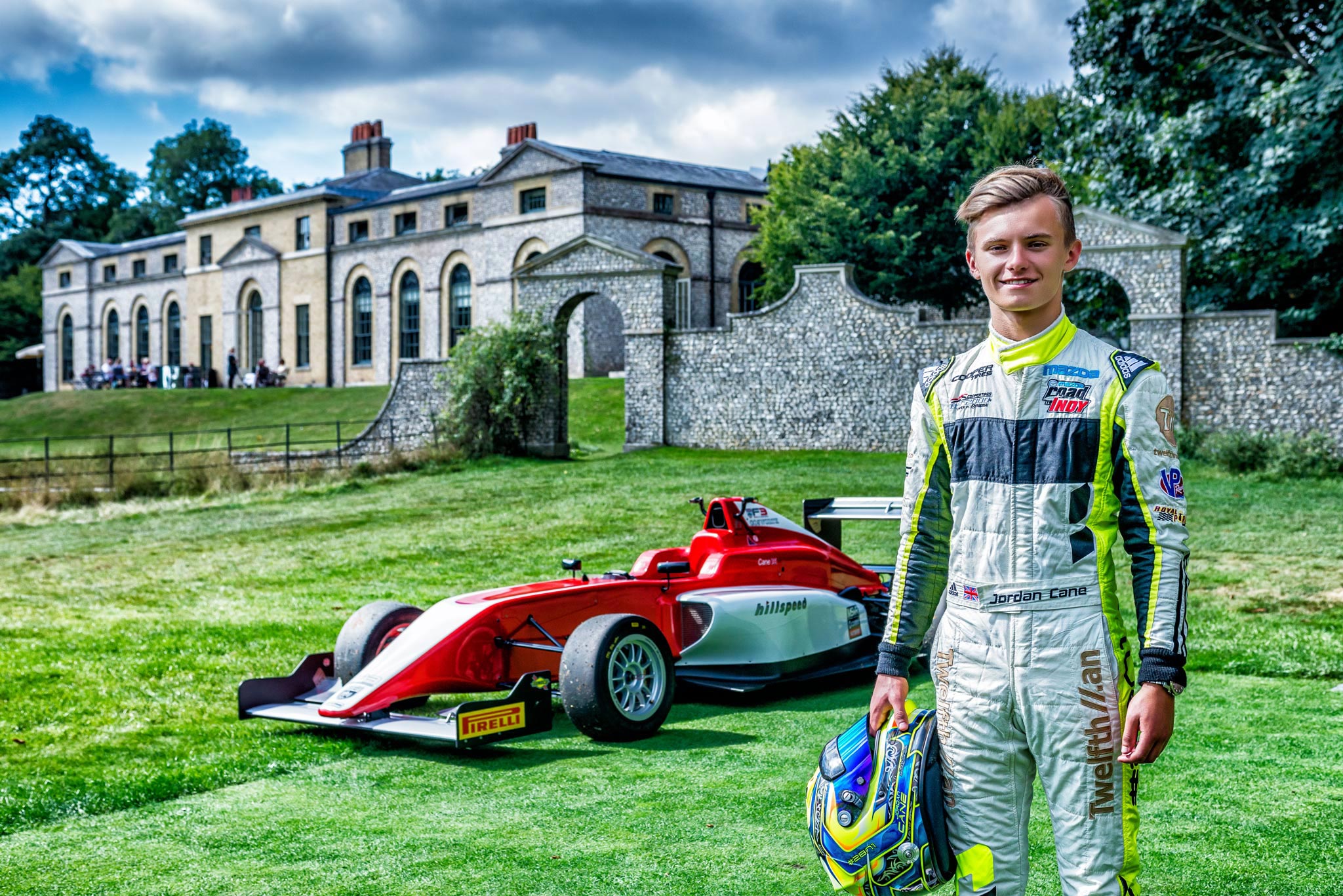 A dynamic shot of a young race driver standing proudly in front of his Formula race car, helmet in hand, ready for action on the track. This aspiring talent embodies determination and passion for motorsport, expertly captured by Wright Content, your trusted sports photographer.